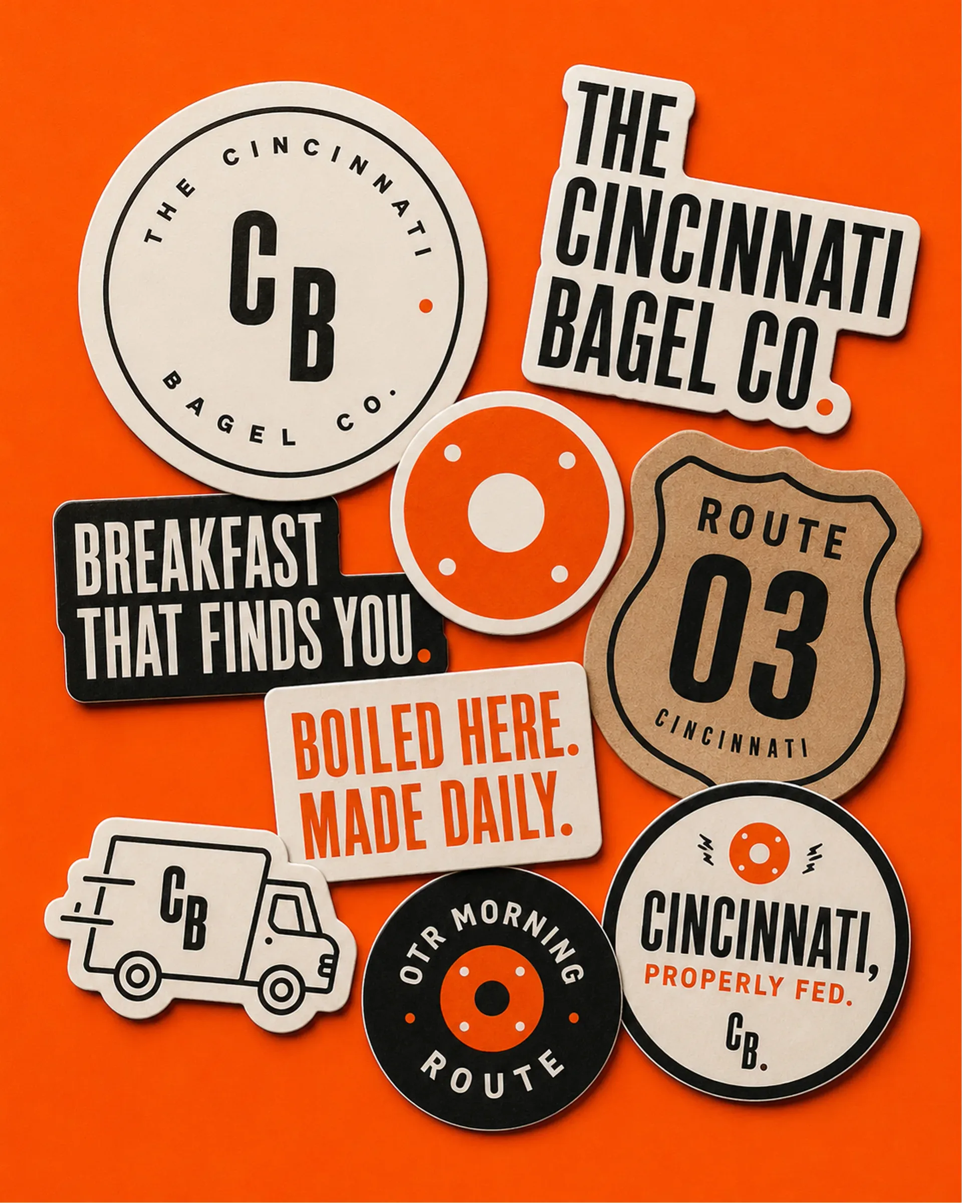 The Cincinnati Bagel Co. — Cincinnati Bagel Co. stickers and brand badges on an orange background