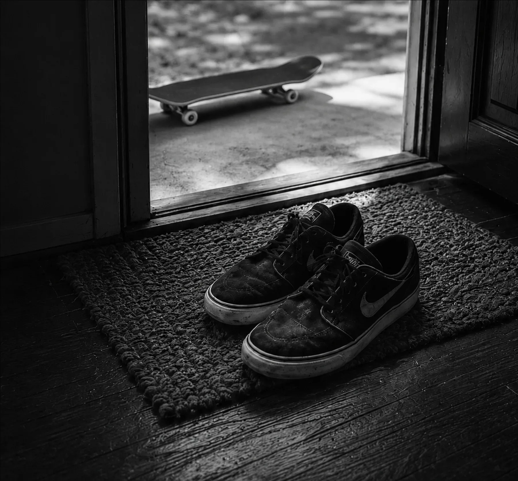 For Daily Use — Worn black Nike SB Janoski shoes in a doorway with For Daily Use campaign language