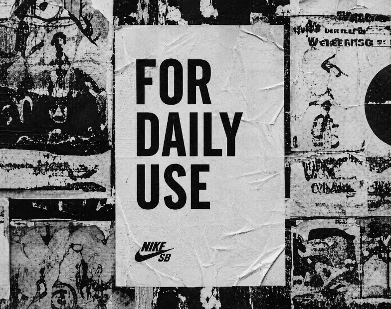 For Daily Use — For Daily Use poster pasted on a layered city wall