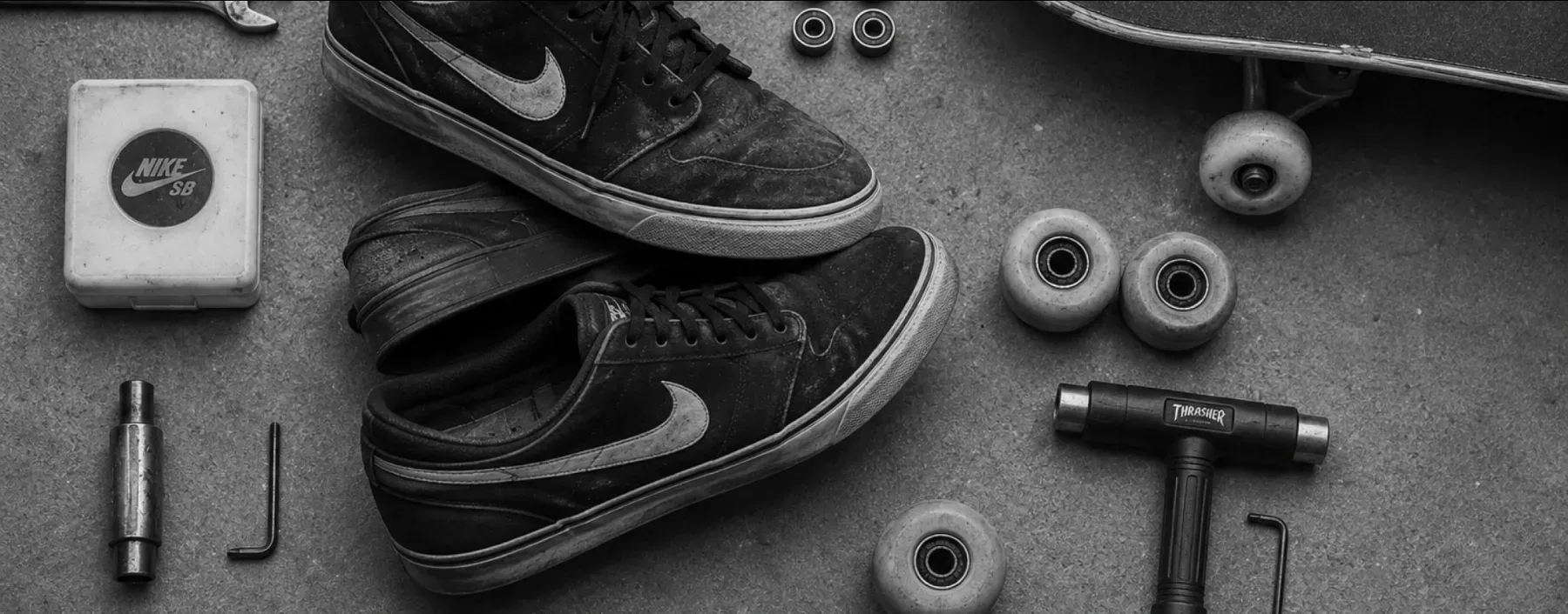 For Daily Use — Black Nike SB Janoski shoes arranged with skate tools and hardware
