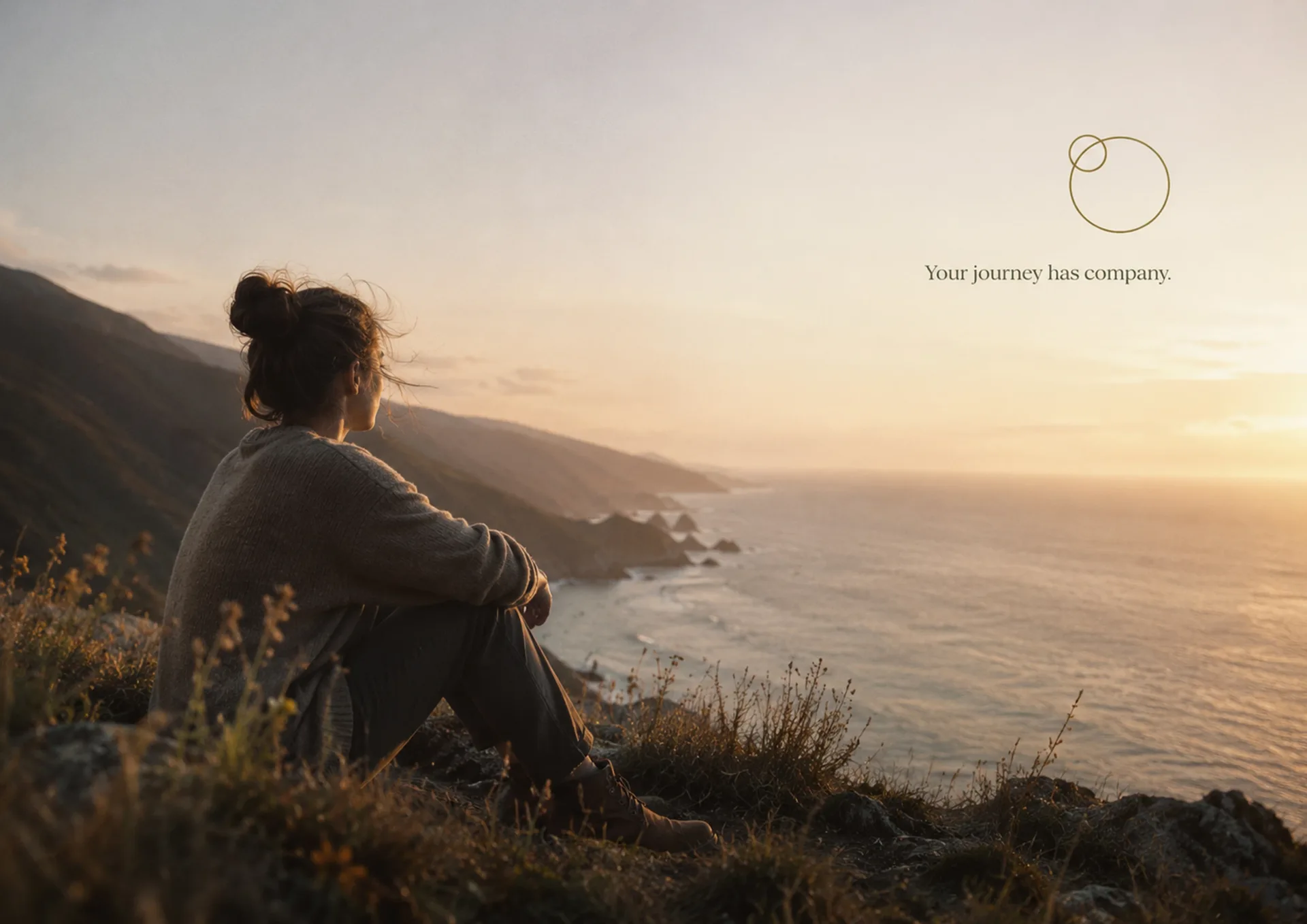 Gentle World Collective — Gentle World Collective coastal hillside landscape with a seated person and the line Your journey has company