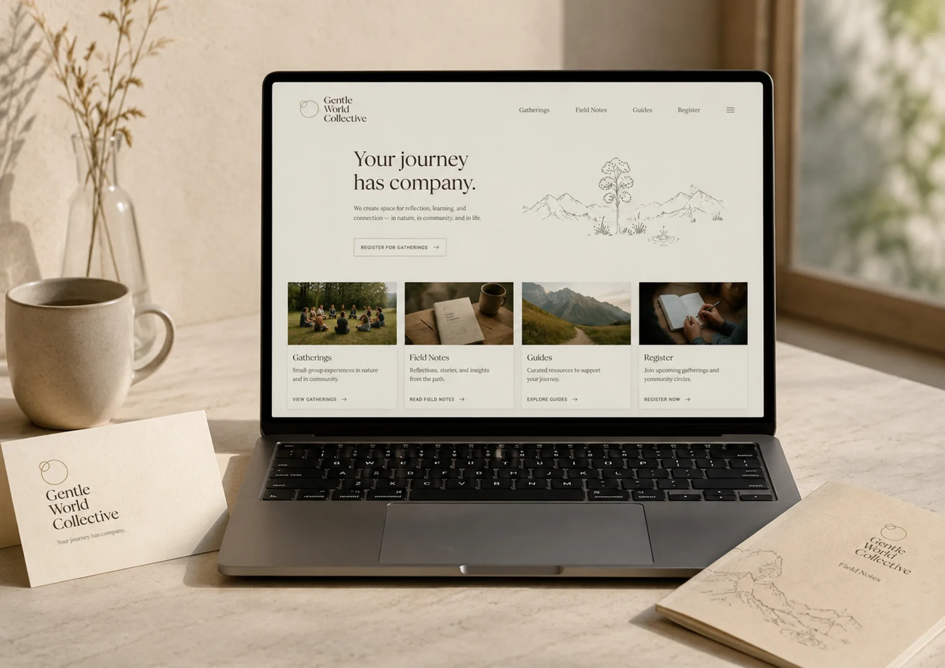 Gentle World Collective — Gentle World Collective digital home page on a laptop with retreat journey cards and printed materials