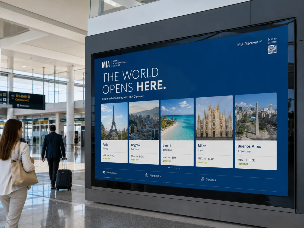 Opens Here — MIA Discover digital wall with destination cards and live flight status