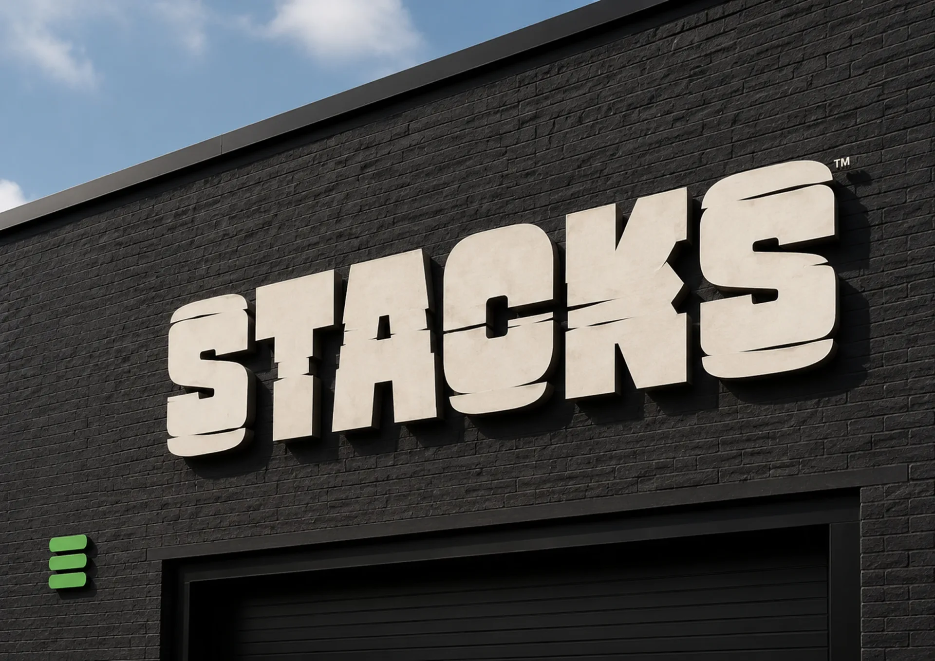 Stacks — Large Stacks wall sign with green stack mark on a dark brick building
