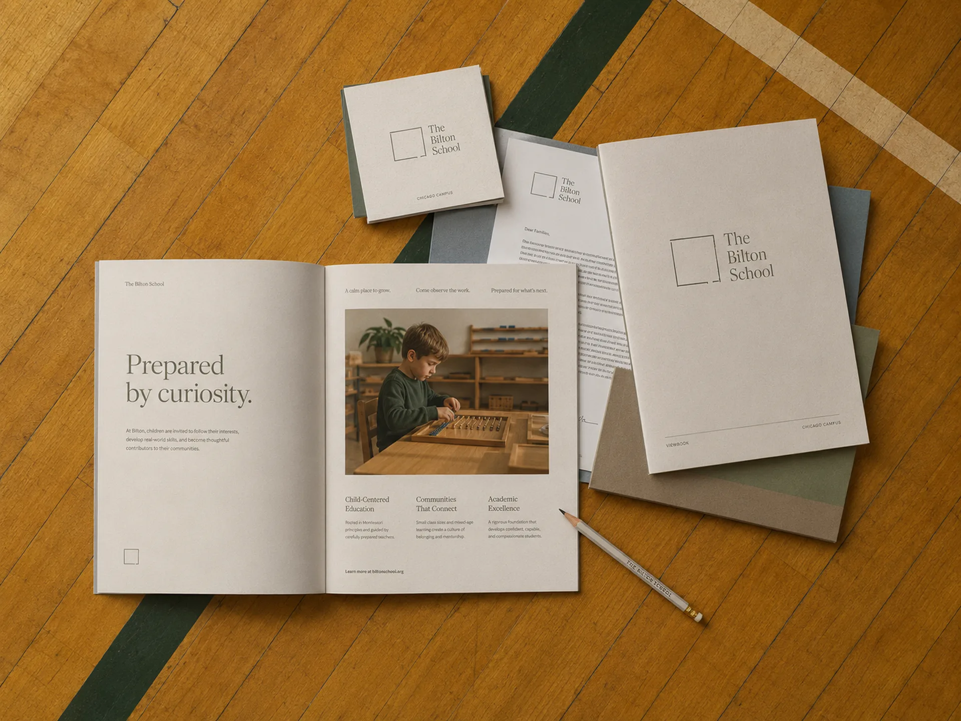 The Bilton School — Brochure, letterhead, folder, and pencil on a gymnasium floor with Chicago Campus stationery