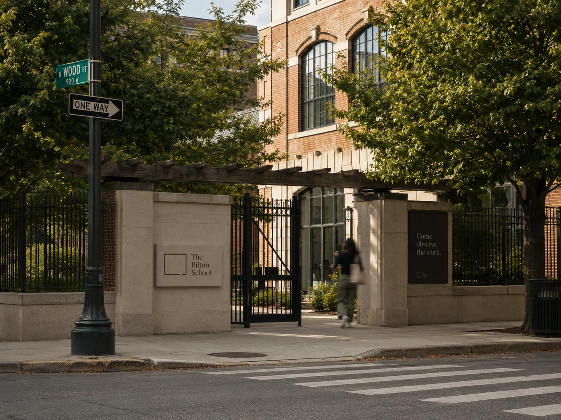 The Bilton School — Wood Street gate with stone pillars, iron fencing, and Come observe the work signage