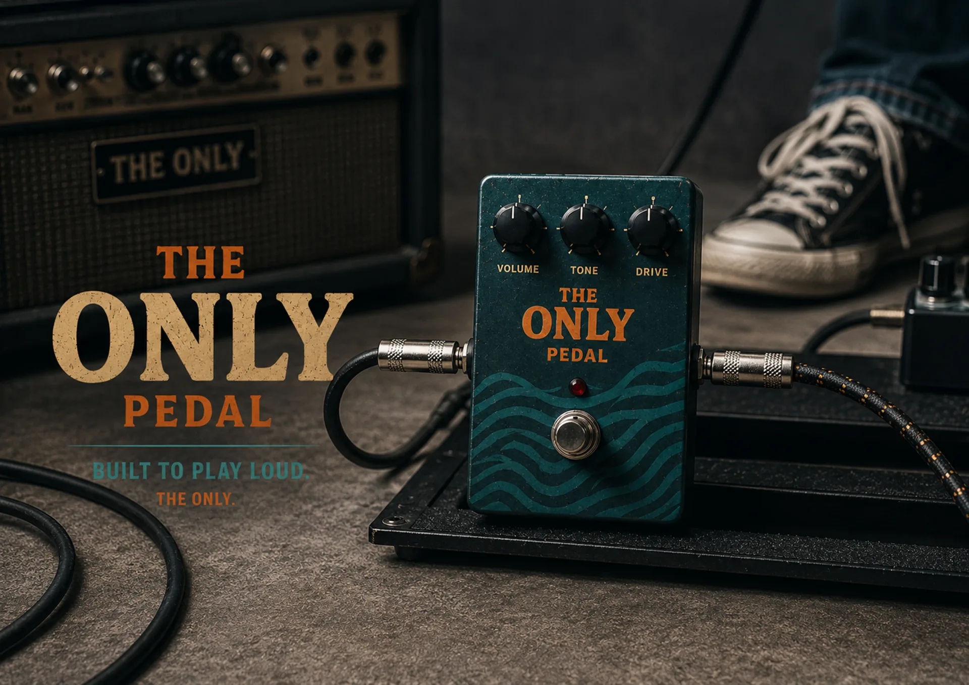 The Only — The Only effect pedal connected to cables beside amplifier, shoe, and built to play loud language